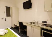 View of Queen studio kitchenette