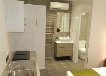 Queen motel room with kitchen and bathroom