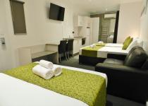 Queen bed and room view in Family Studio Room